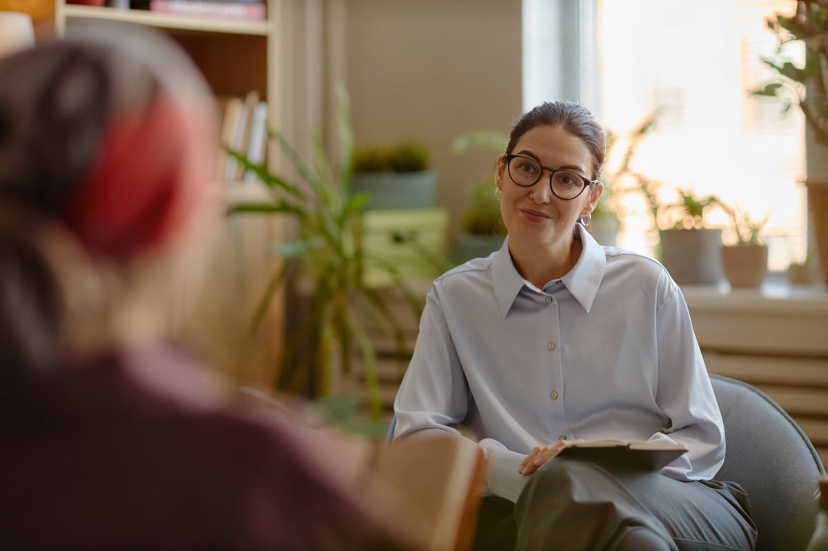 NDIS behaviour support practitioner consulting with client